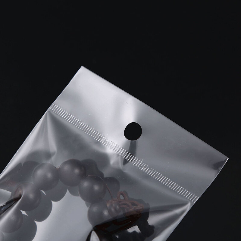 100 قطعة كيس لاصق ذاتي اللصق شفاف حقيبة OPP أكياس تخزين بلاستيكية مع فتحة تعليق لتغليف عرض المجوهرات بالتجزئة