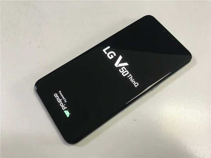 هاتف LG V50 ThinQ الأصلي V500N بشاشة 6.4 بوصة وذاكرة وصول عشوائي 6 جيجابايت وذاكرة قراءة فقط 128 جيجابايت وكاميرا خلفية ثلاثية بدقة 16 ميجابكسل هاتف LTE بشريحة واحدة وخاصية إلغاء التأمين ببصمة الإصبع
