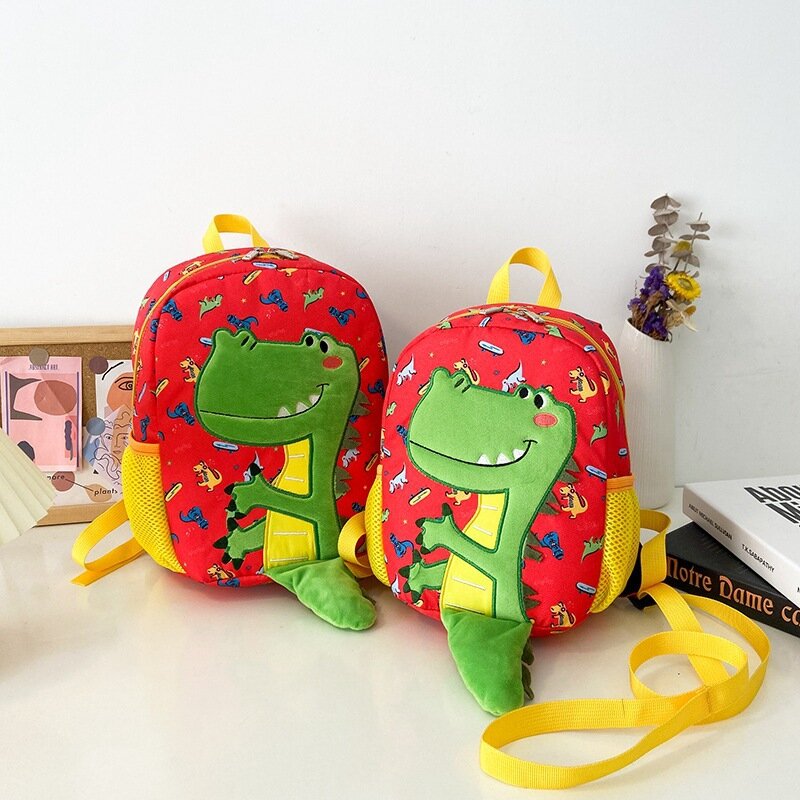 حقيبة مدرسية للبنات والأولاد مُزينة برسوم كارتونية لطيفة في رياض الأطفال من سن 1 إلى 3 إلى 5 سنوات مضادة للضياع حقيبة ظهر شهيرة للأطفال على شكل ديناصور هدية