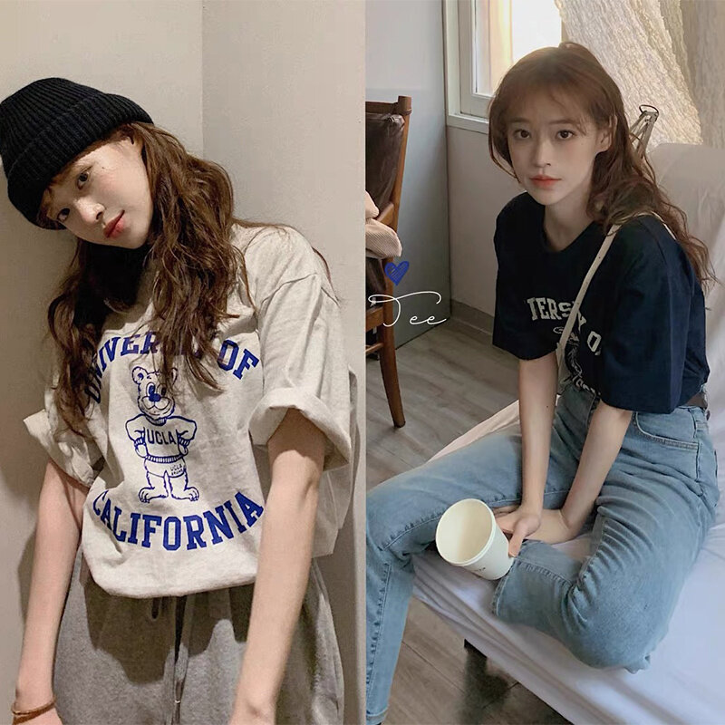 قطعتين مجموعة النساء كوريا الجنوبية شيك الربيع والصيف لعوب الحد من العمر إلكتروني الكرتون قميص مطبوع برقبة مستديرة فضفاضة تنوعا