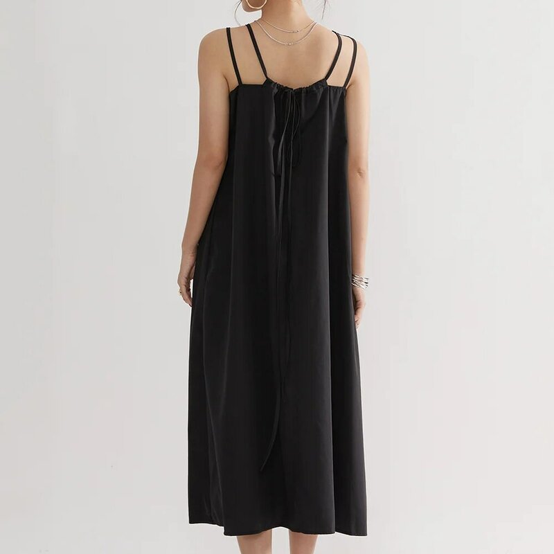 فستان أسود عتيق غير رسمي فضفاض تنورة متوسطة الطول بسيطة بلون ياباني للشاطئ تنورة شمس مزيفة موضة صيف 2021 جديد