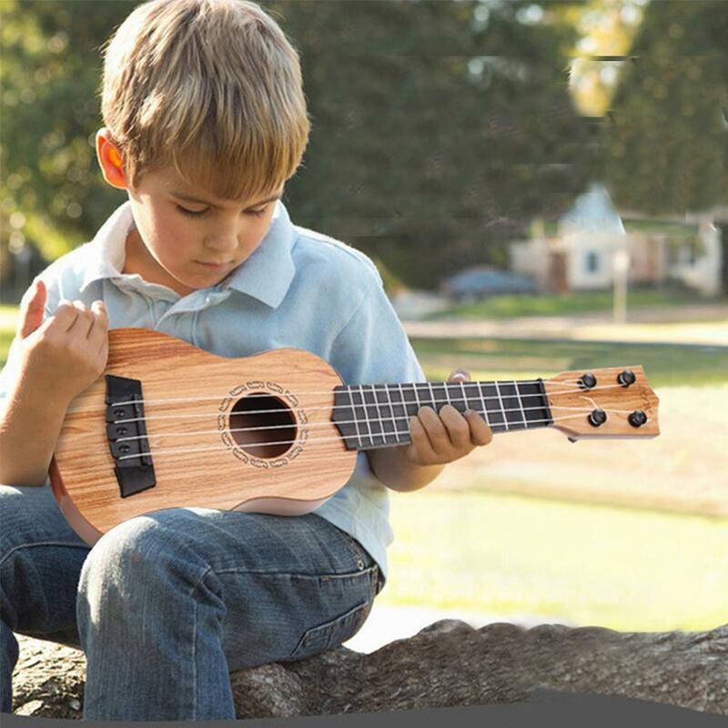الأطفال القيثارة سوبرانو المبتدئين القيثارة الغيتار المبتدئين الماهوجني ضبط القيثارة أوتار الرقبة 4 حساسة الخشب Pe A2s0