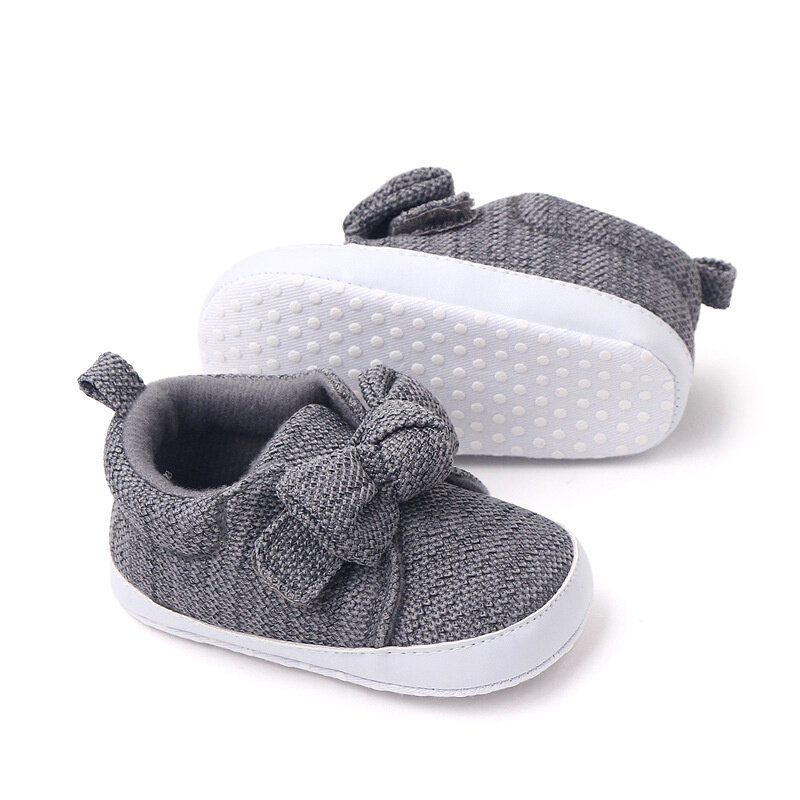أحذية للأطفال الرضع والأولاد والبنات أحذية لينة وحيد بلون واحد للأطفال حديثي الولادة سرير أطفال Bowknot المضادة للانزلاق الأولى مشوا